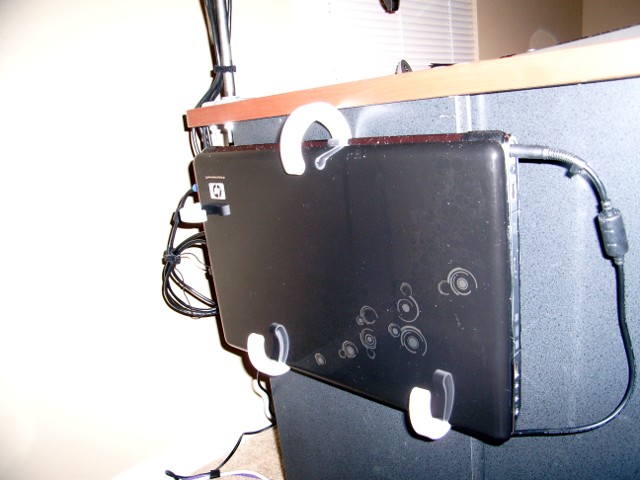 Laptop hanging from the unpainted J hooks