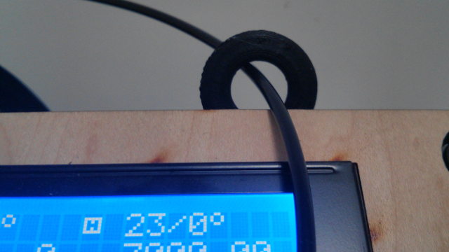 The guide loop peeking out over the LCD display