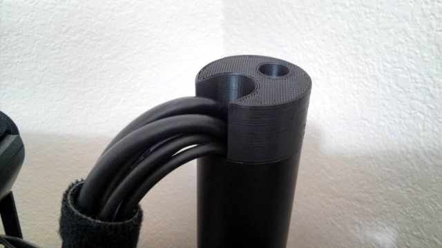 The mounting bracket attached to the monitor stand