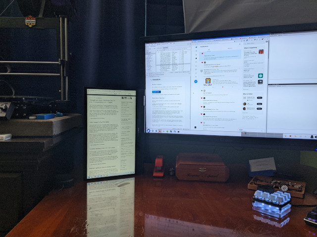 Asus Vivobook Flip 14 next to my 27-inch monitor