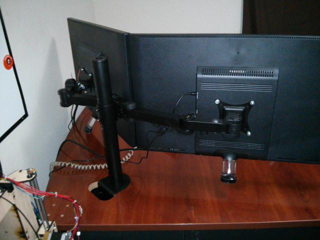The stand is quite sturdy and has no trouble holding up a pair of 27 inch monitors